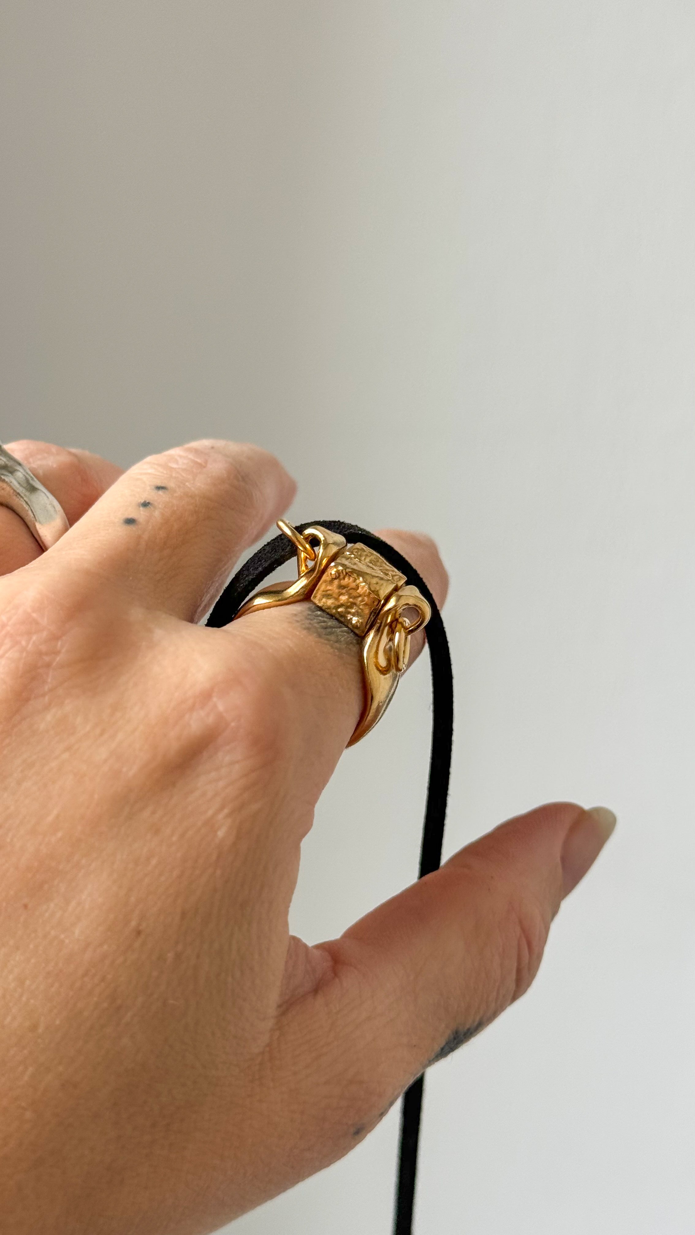 Amphora Golden Ring-Pendant with a Movable Stopper