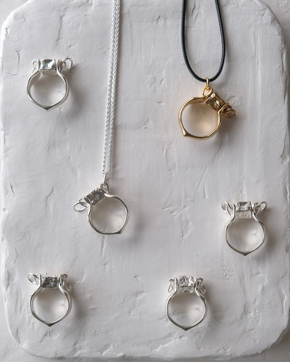 Amphora Golden Ring-Pendant with a Movable Stopper
